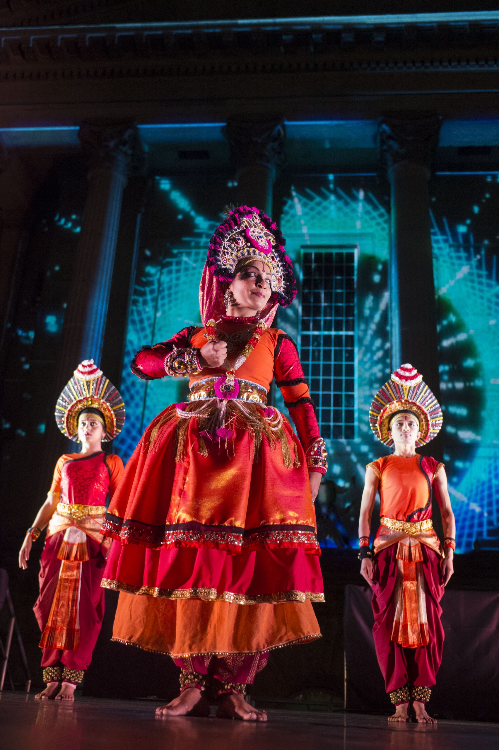 Mandala-Devika-and-dancers against blue lighting