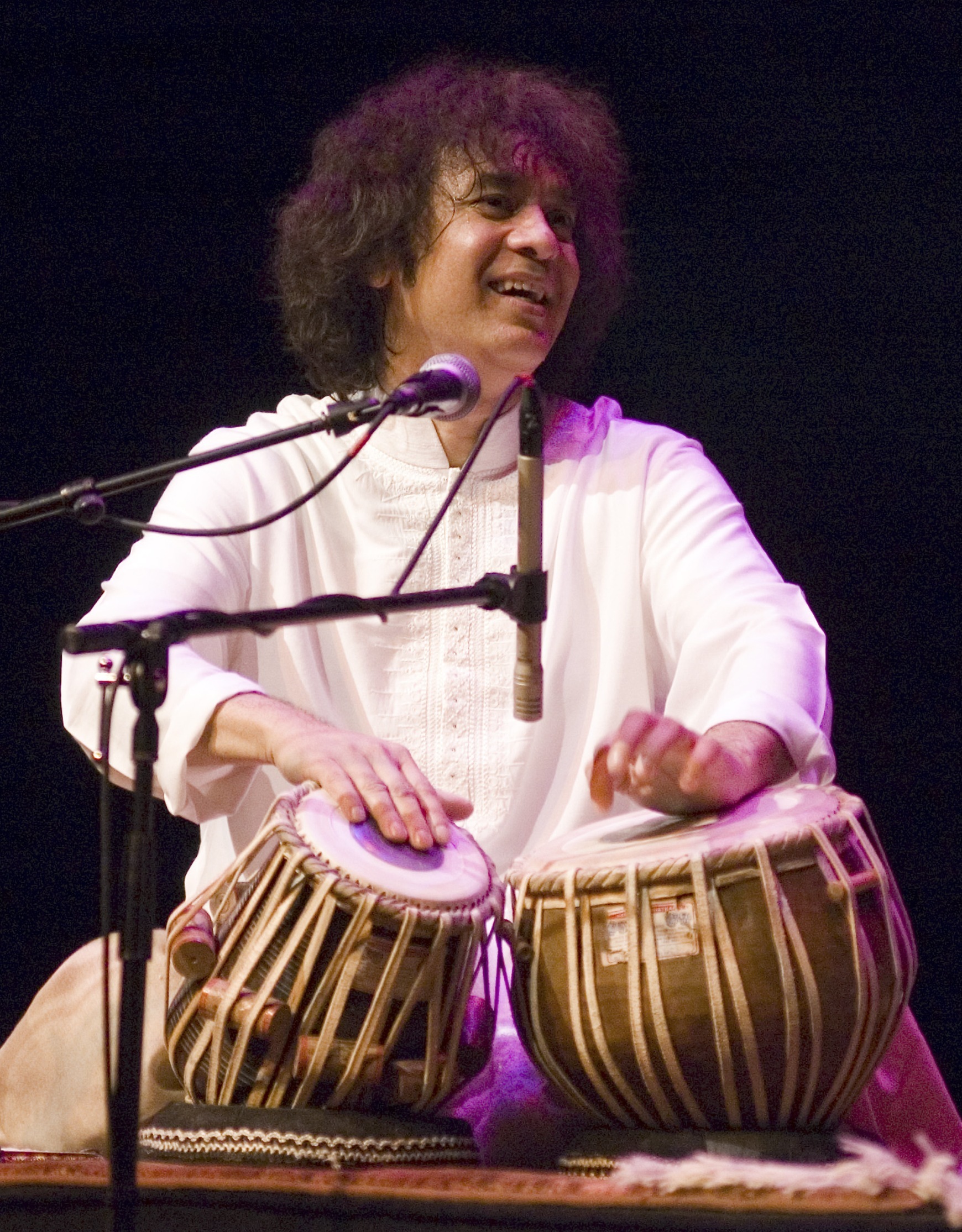 Performing with tabla on stage - Zakir Hussain