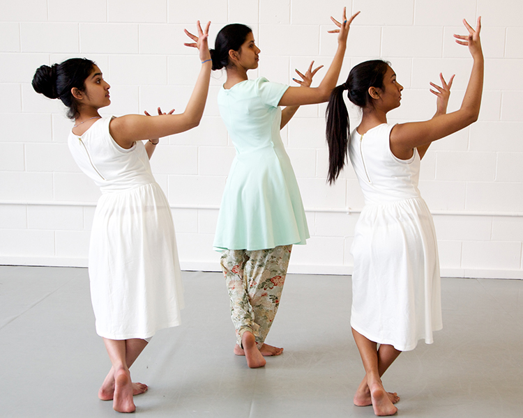 Asian Spring 2013 three girls, two in white dresses on in blue in a rehearsal studio