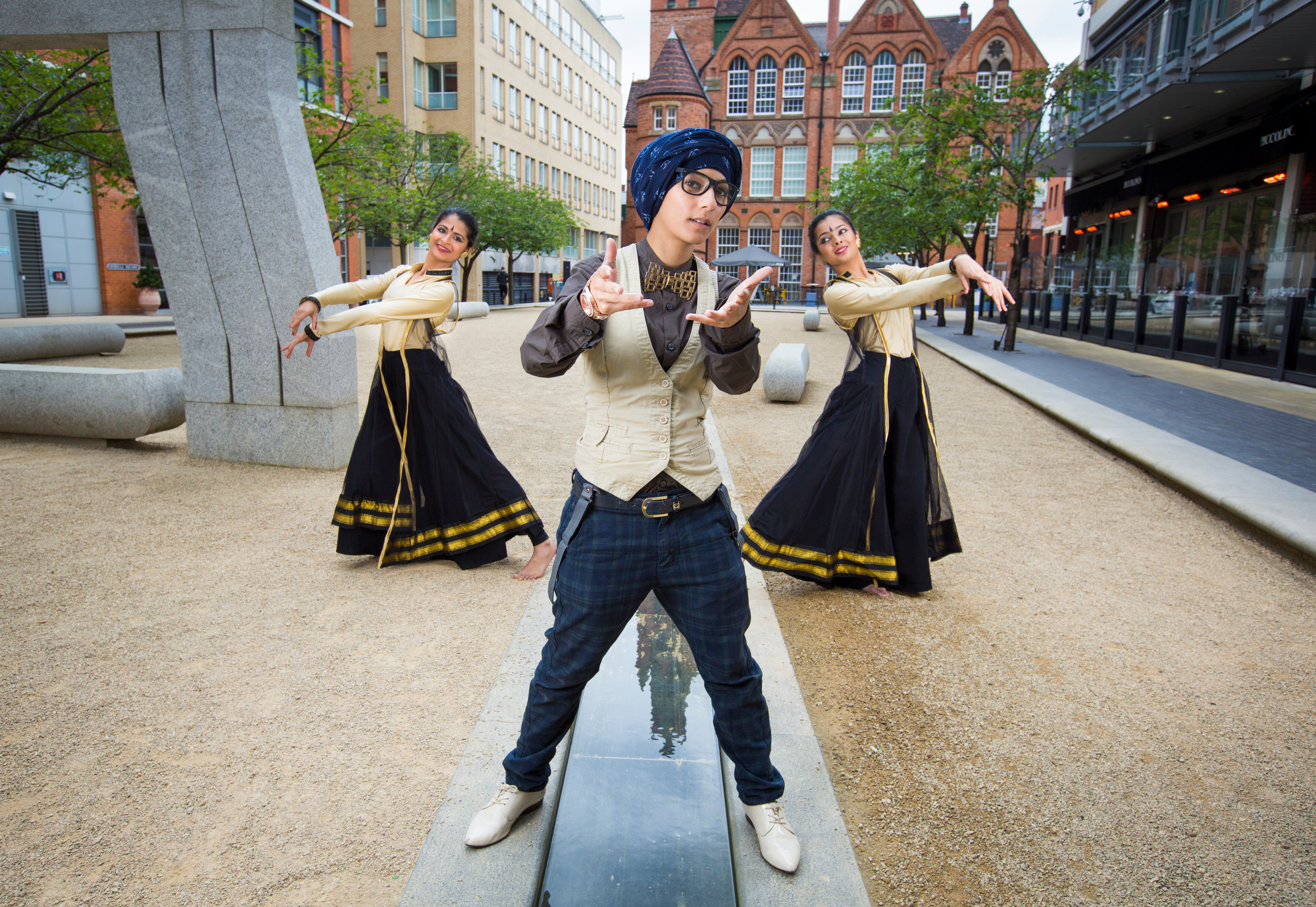 Birmingham Weekender promo shots, a boy at the centre looking at the camera with two women posing outwardly either side of him