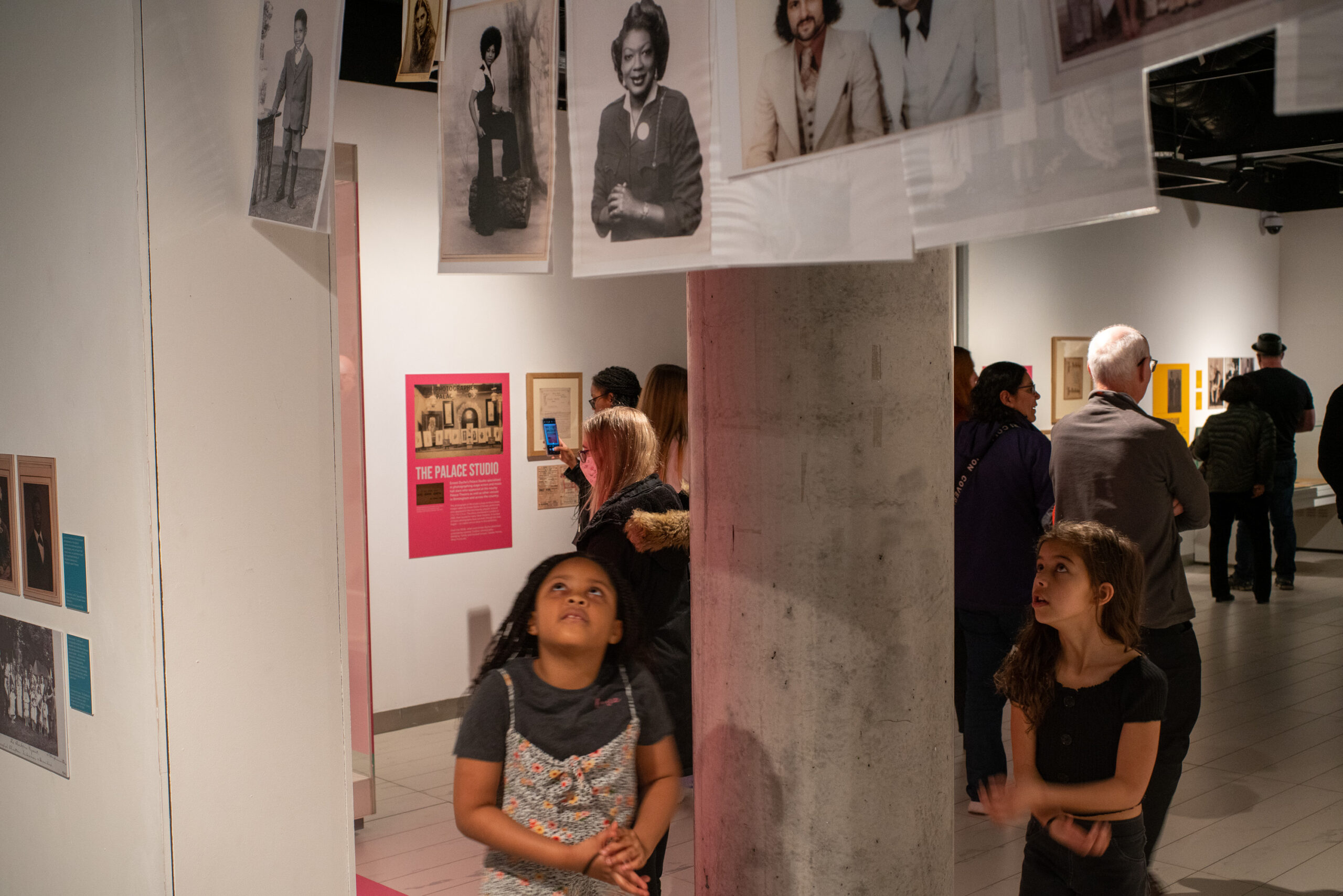 a couple of images engaging with the exhibit