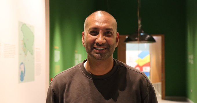 Headshot of a man inside the exhibition space