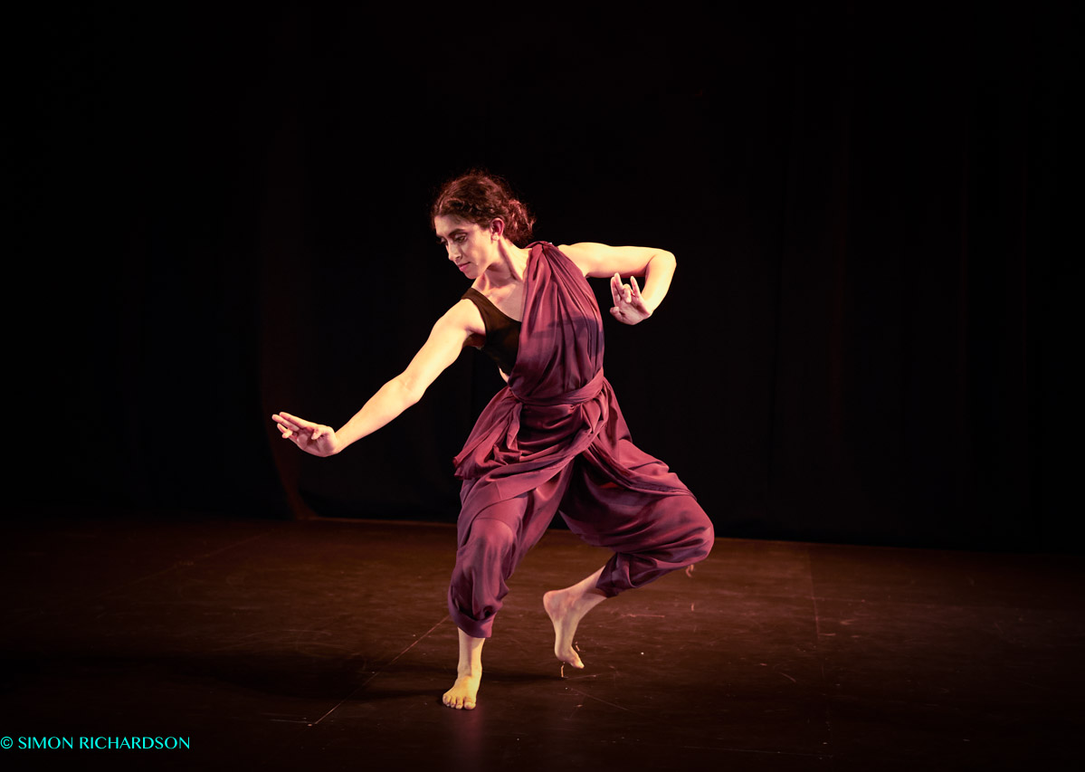 a female dancer pro-shot in a red outfit