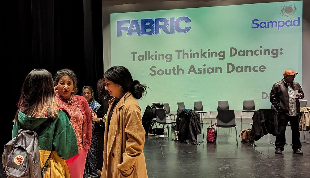 People talking in a studio at the artist training event 'Talking, Thinking, Dancing'