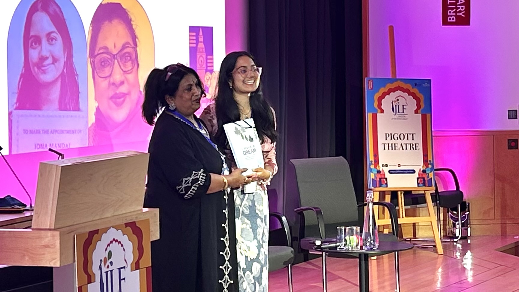 Piali Ray and Iona Mandal smiling, holding the I have a dream book