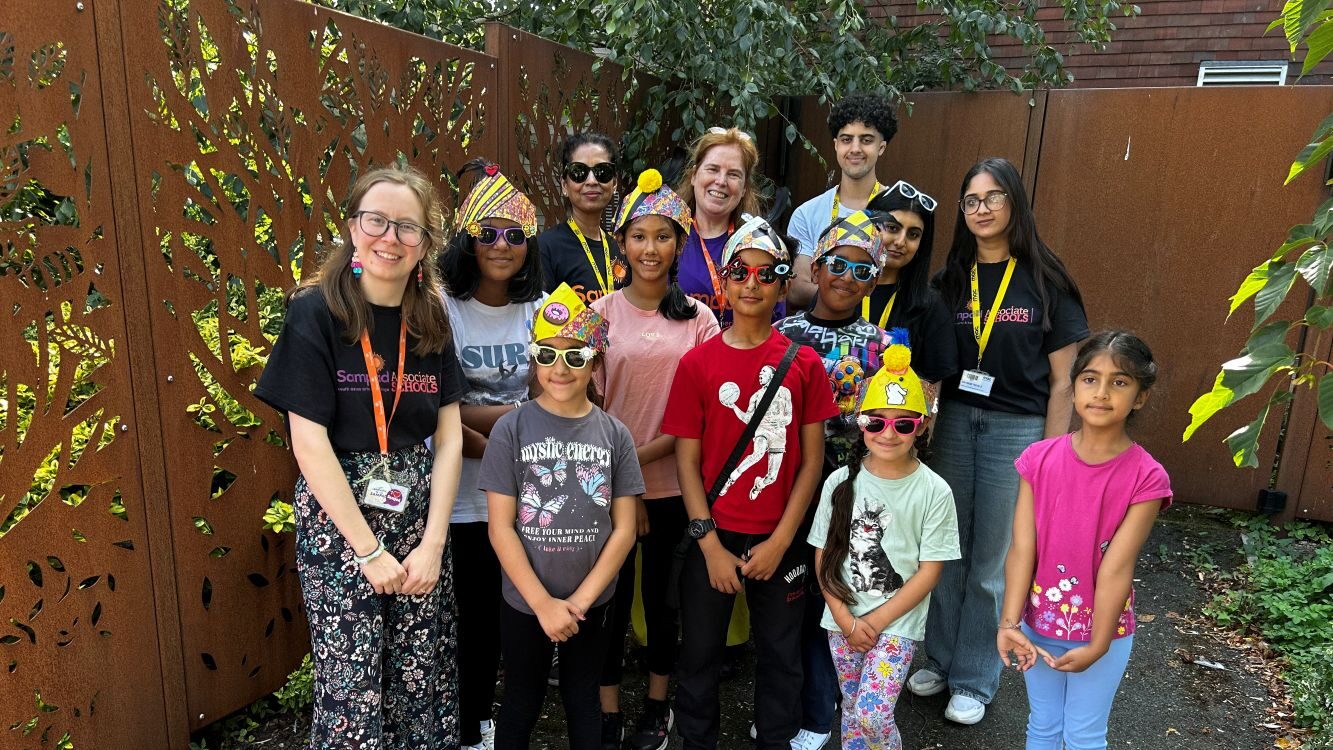 Sampad team with a group of children