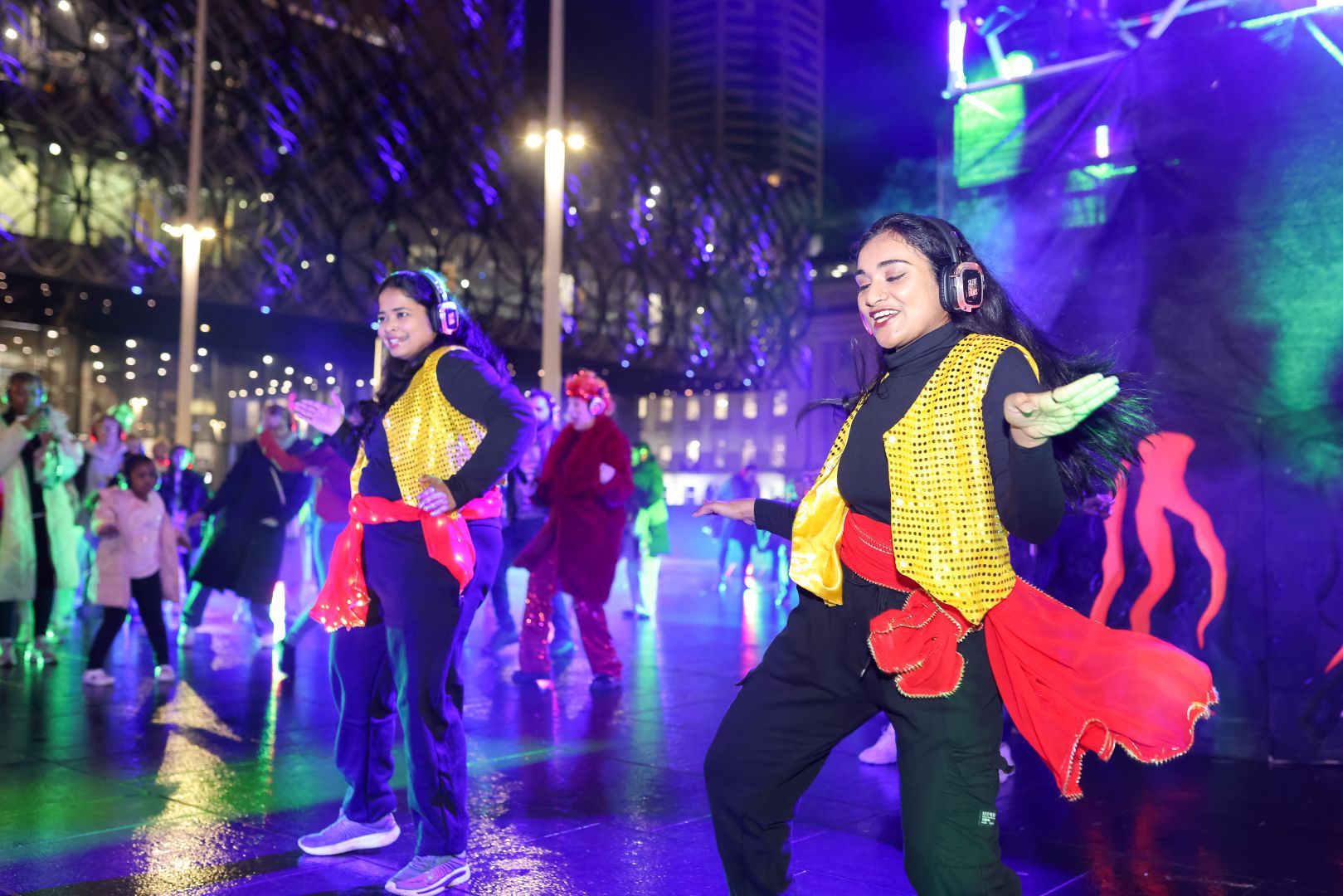 Two women smiling and dancing